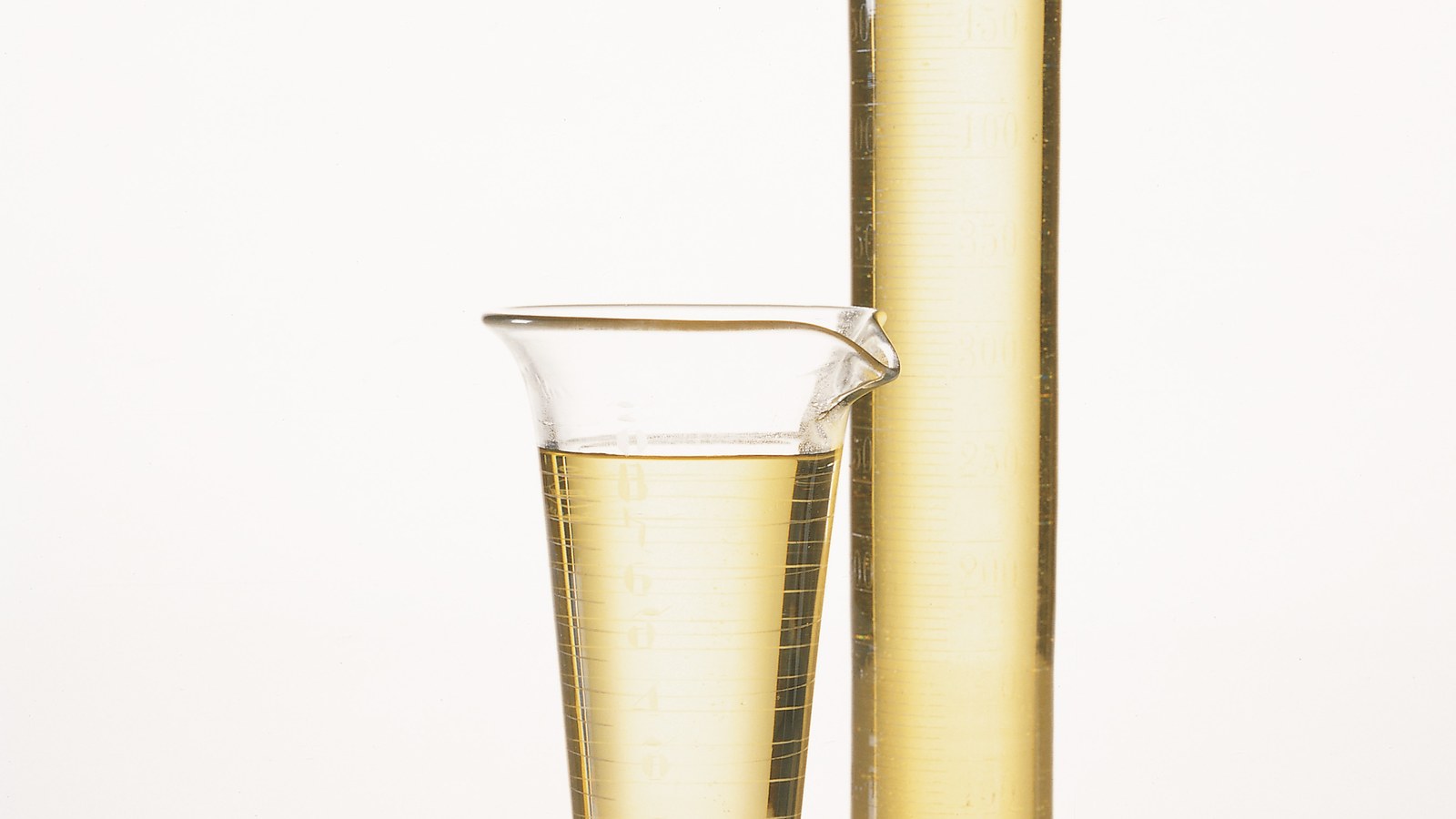 Bio-Based Hot-Melt PSA Plasticizers: Buyer Checks for 2026 Soybean oil in laboratory glassware illustrating bio-based plasticizers for hot-melt pressure-sensitive adhesives